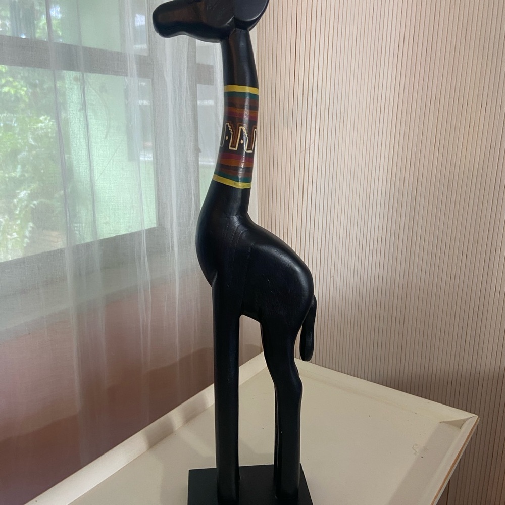 Black Wooden Giraffe Sculpture with Colorful Accents
H 21.5”.  X.  2”. X. 4”.